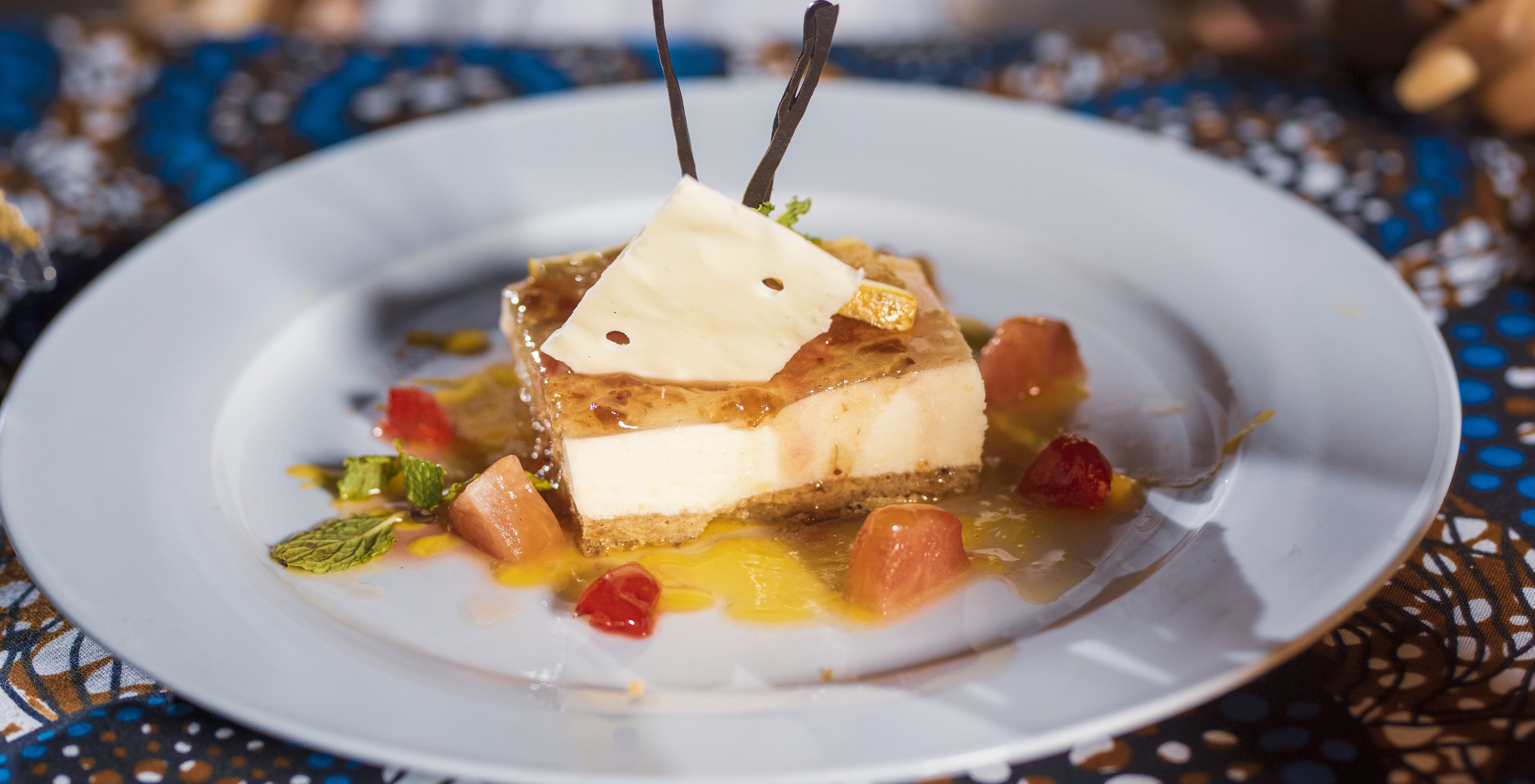 A dessert on a plate with a decorative pattern.
