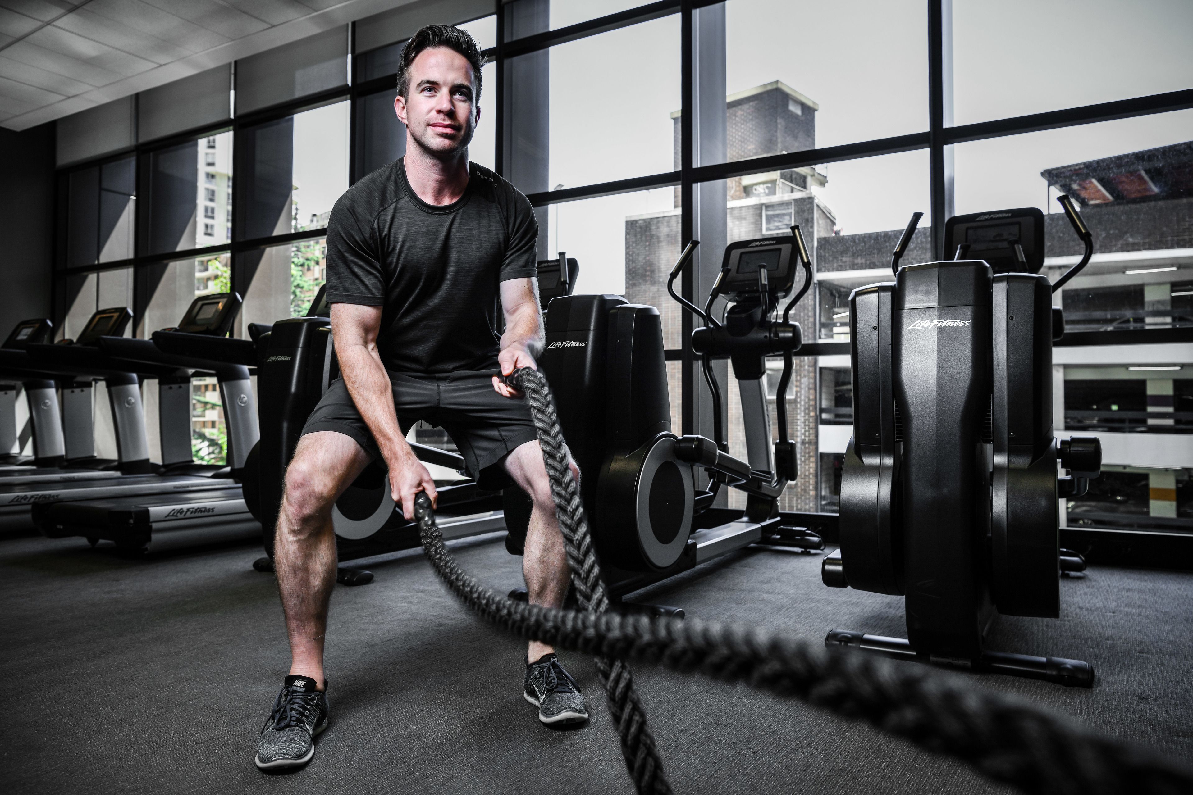 A gym with exercise equipment, including treadmills and weight machines.