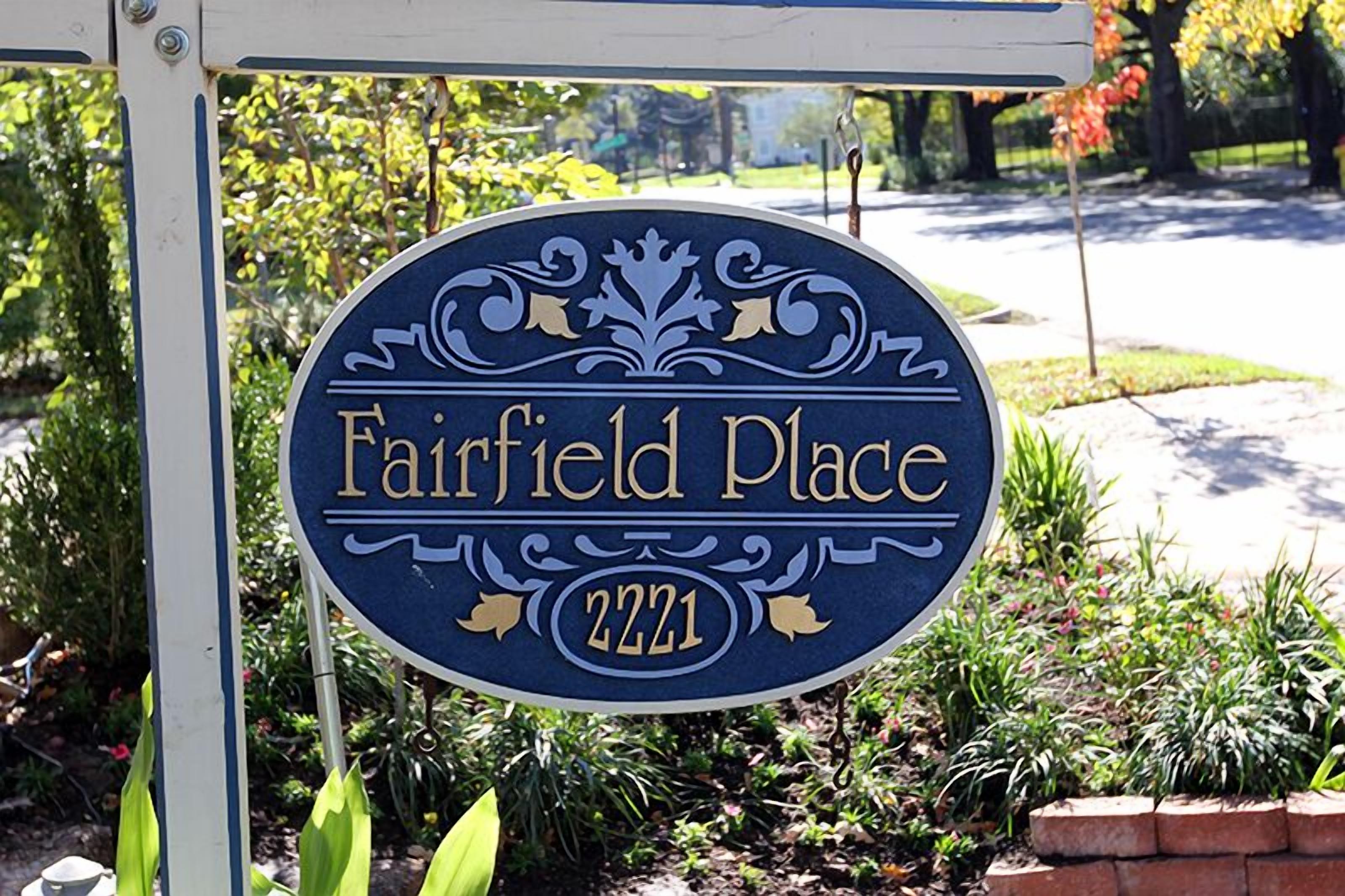 A house sign for Fairfield Place with the number 2221.
