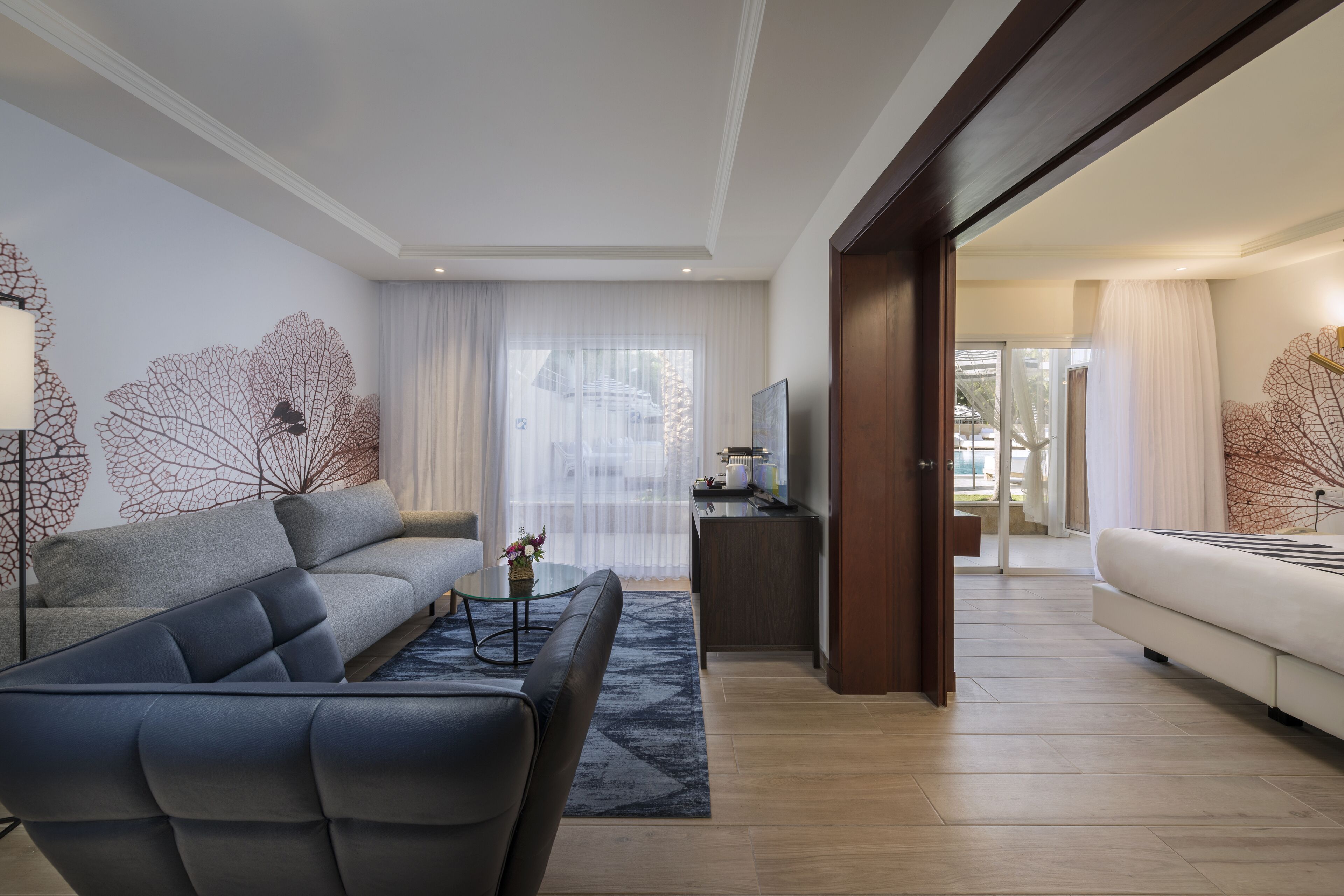 deluxe suite, pool access | living room | tv, pay films