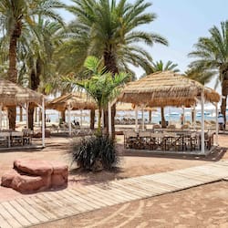 On the beach, sun-loungers, beach umbrellas, beach towels