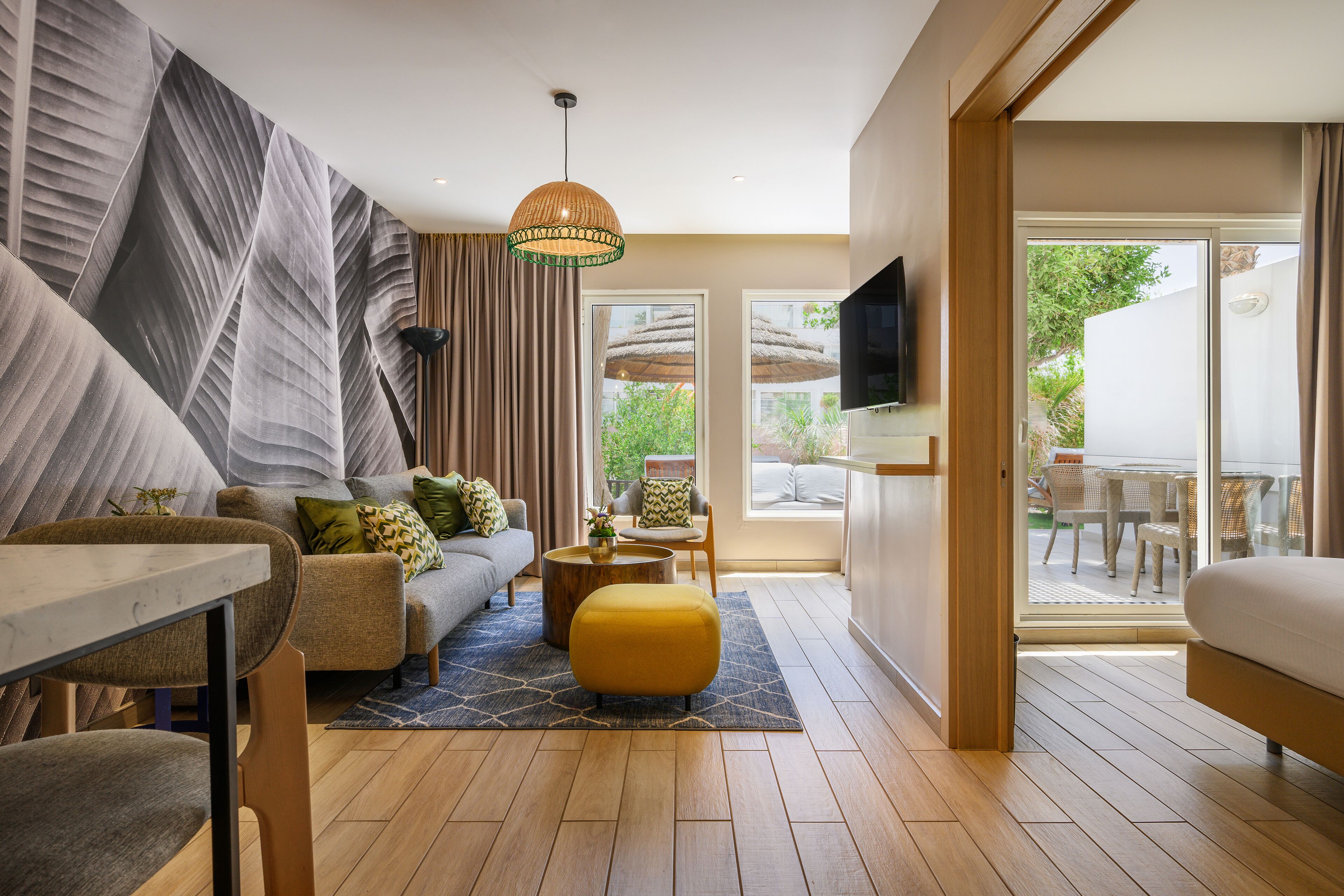 family suite, pool access | living area | tv