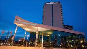 A modern hotel with a glass facade and a prominent sign reading "Hotel Diamante Beach". - AR Diamante Beach Spa & Convention Center (Calpe)