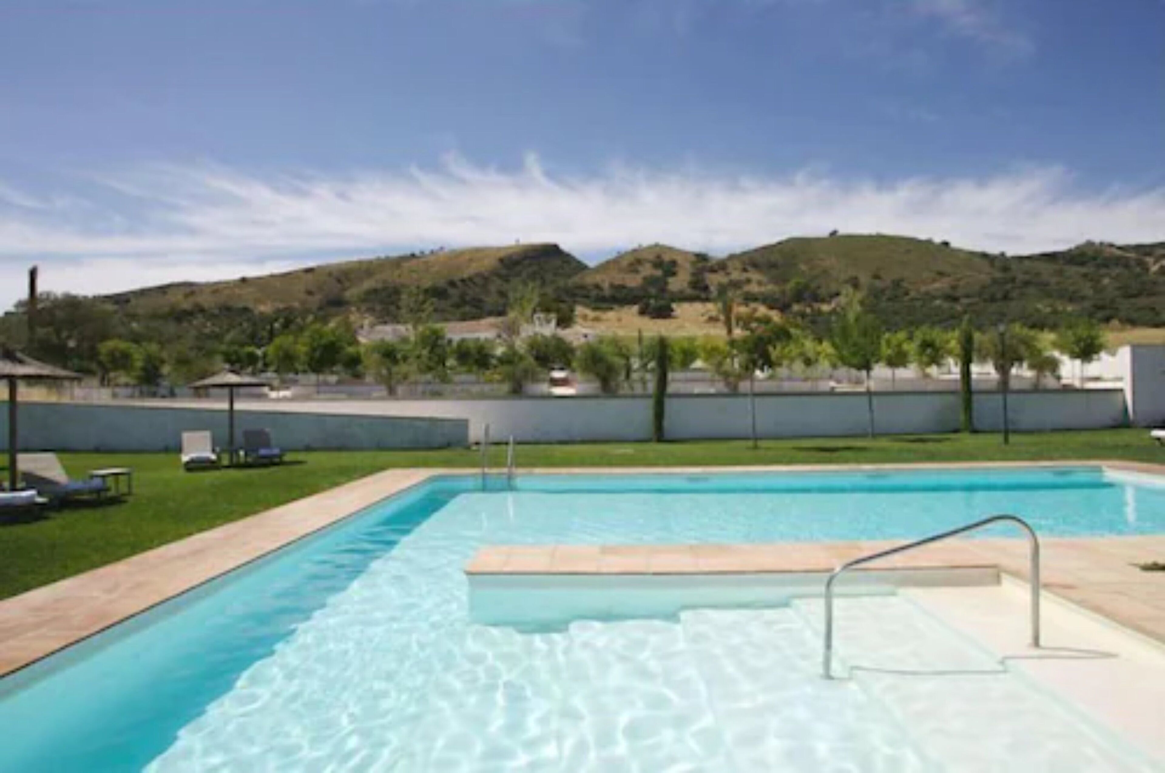 seasonal outdoor pool, pool umbrellas, pool loungers