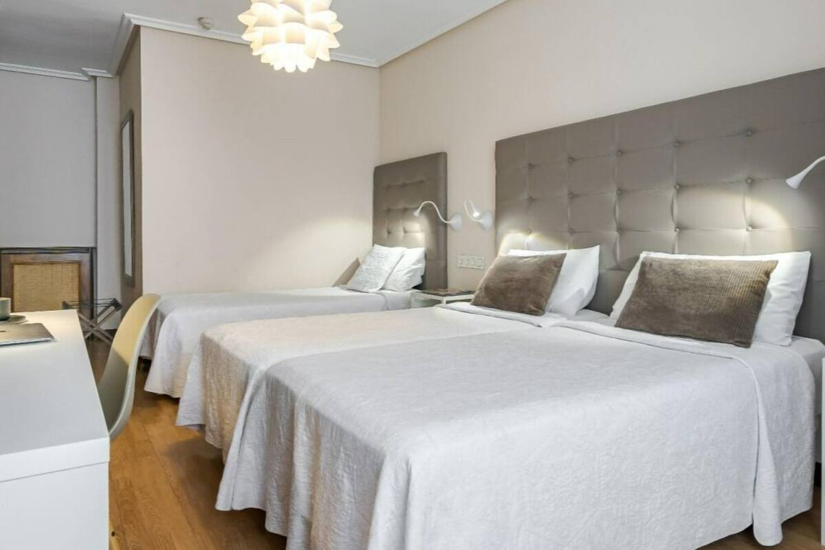 Classic Triple Room | Minibar, in-room safe, blackout drapes, iron/ironing board (on request)