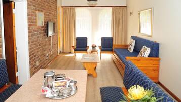 Chalé | Área de estar | TV