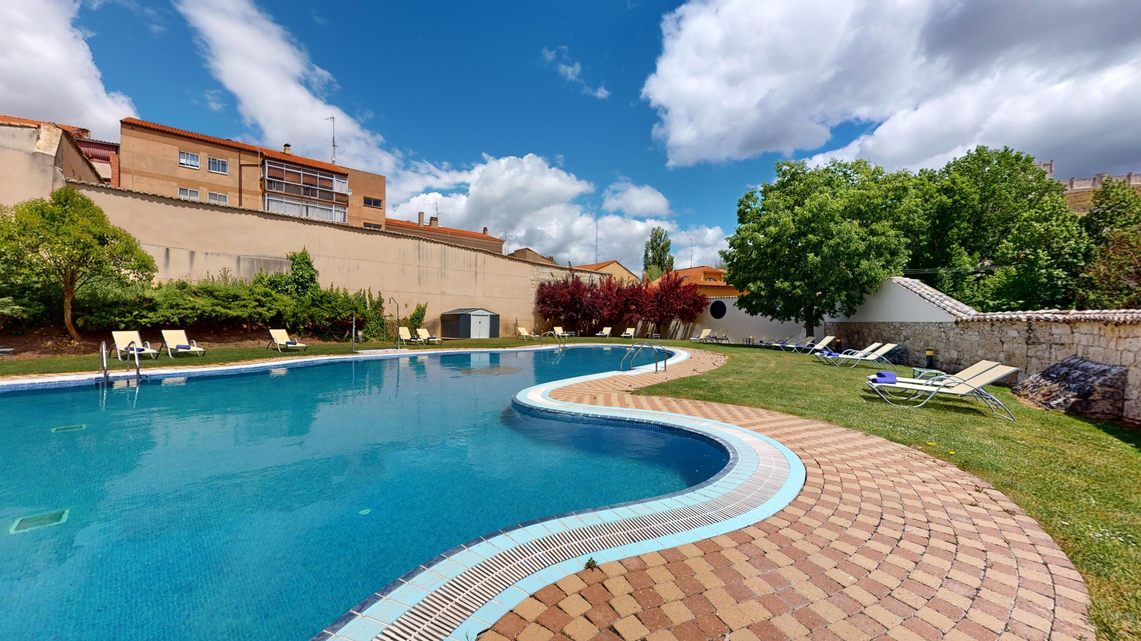 Seasonal outdoor pool, open 11 AM to 7:30 PM, pool umbrellas