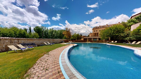 Seasonal outdoor pool, open 11 AM to 7:30 PM, pool umbrellas