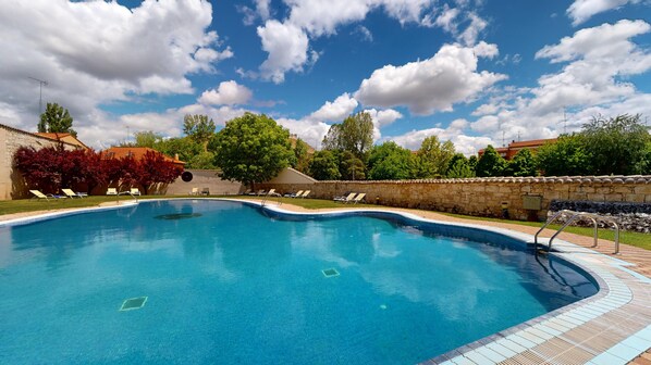 Seasonal outdoor pool, open 11 AM to 7:30 PM, pool umbrellas