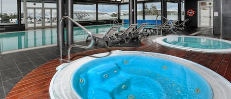 Indoor pool, open 10:00 AM to 9:00 PM, pool loungers