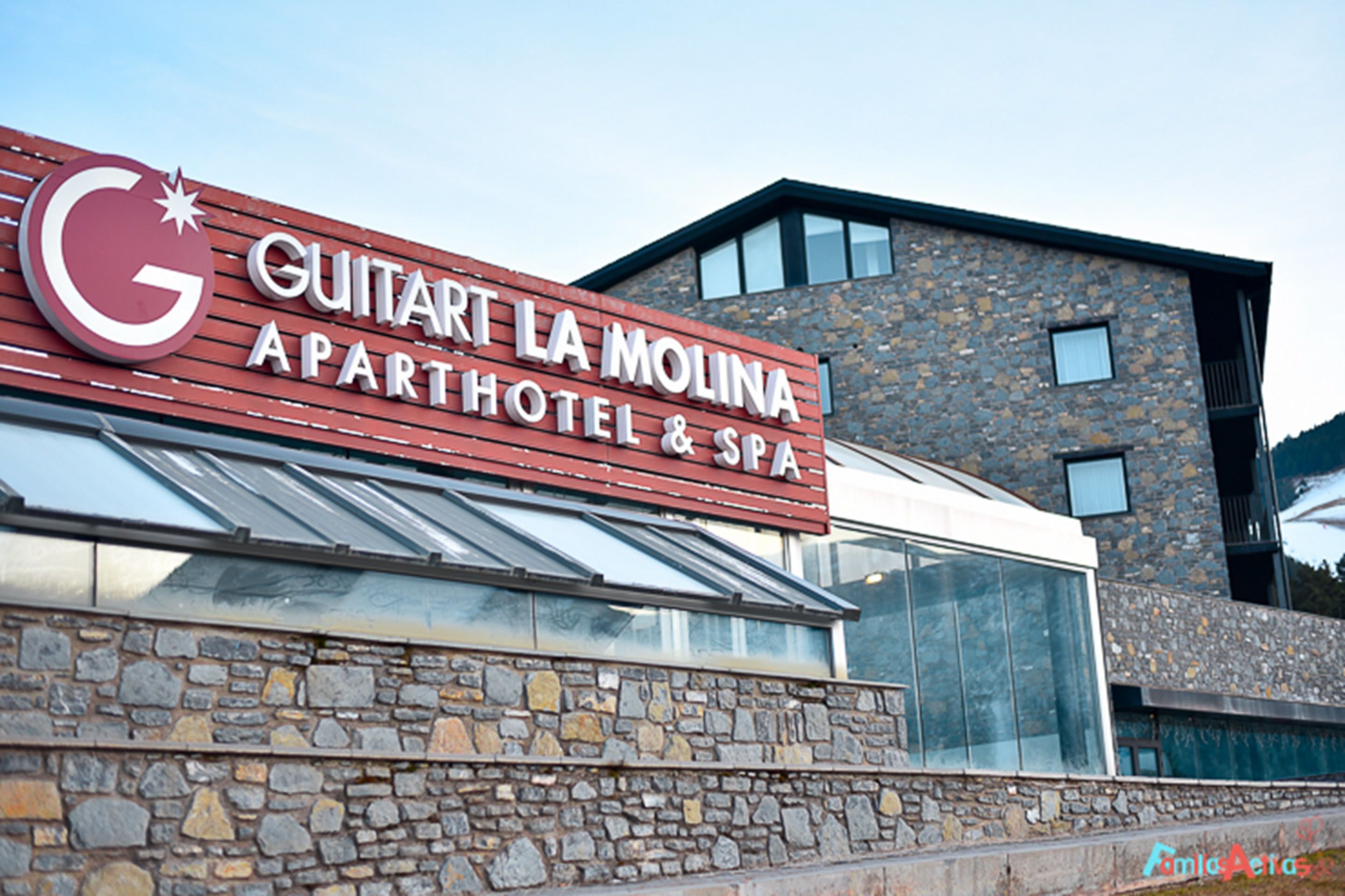 A sign for the Guitart La Molina Apartment Hotel & Spa.