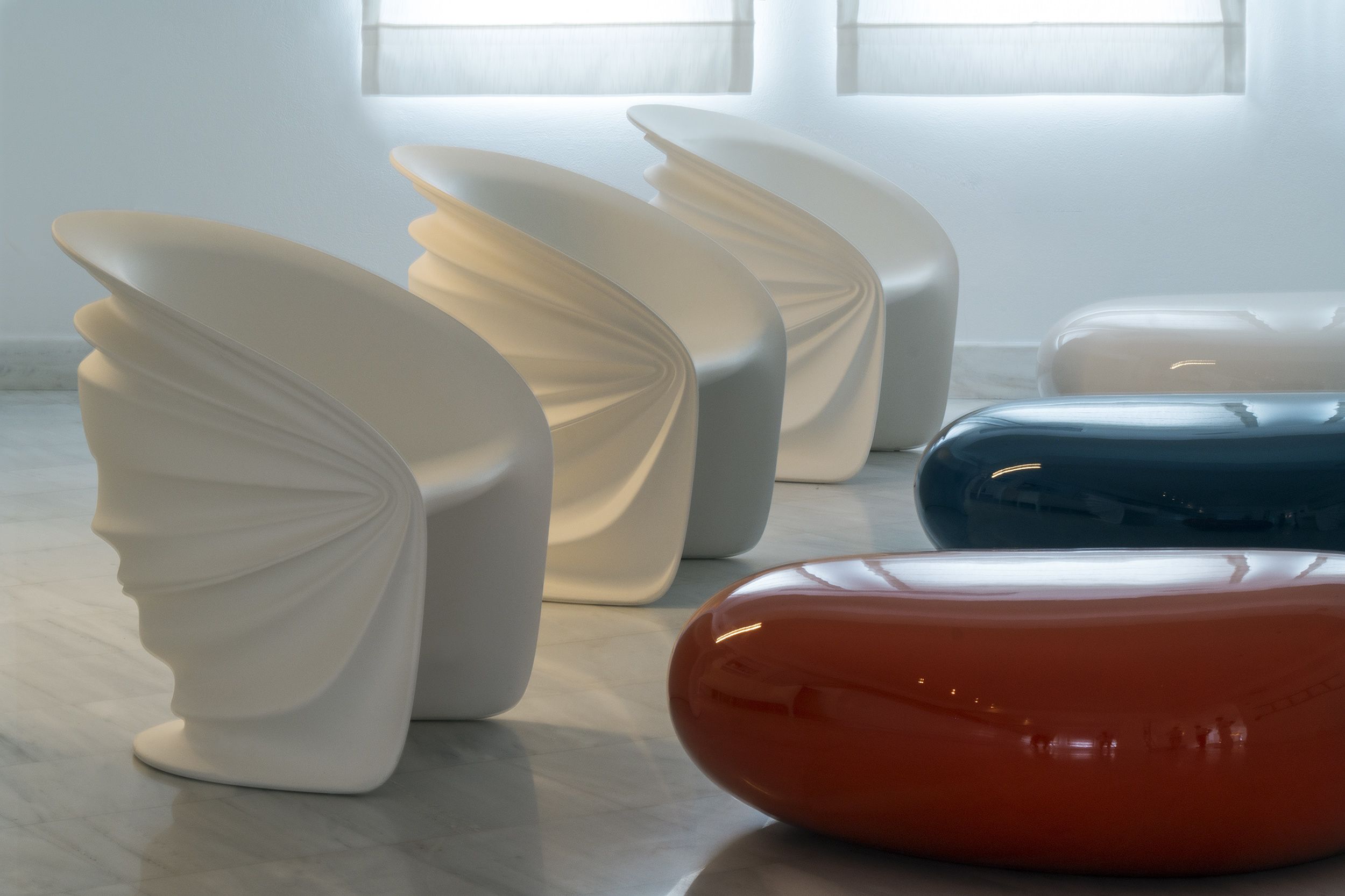 A modern interior with abstract white and blue furniture pieces.