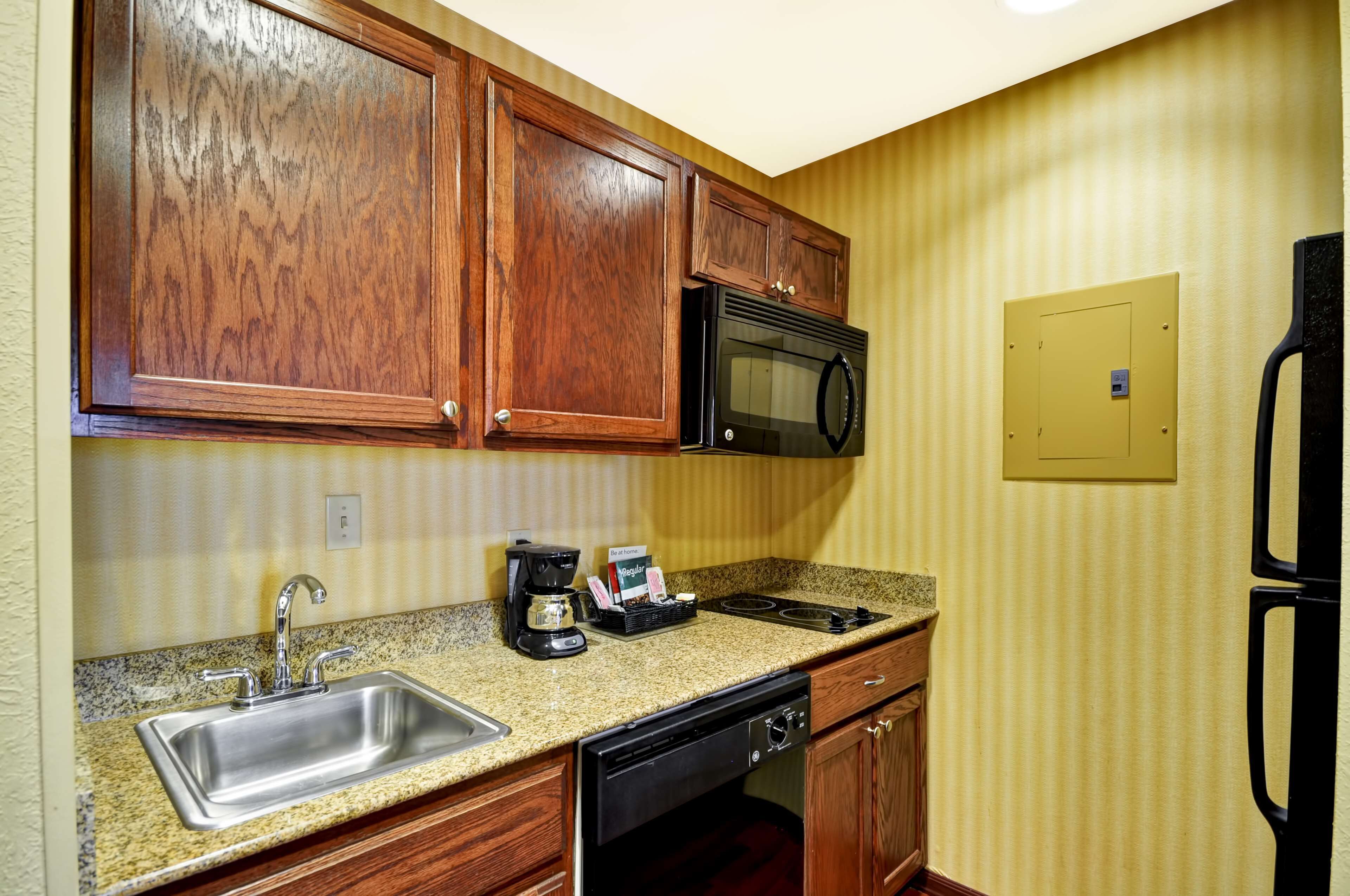 full-sized fridge, microwave, stovetop, dishwasher