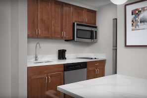 Full-sized fridge, microwave, stovetop, dishwasher