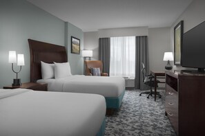 Premium bedding, desk, laptop workspace, blackout drapes