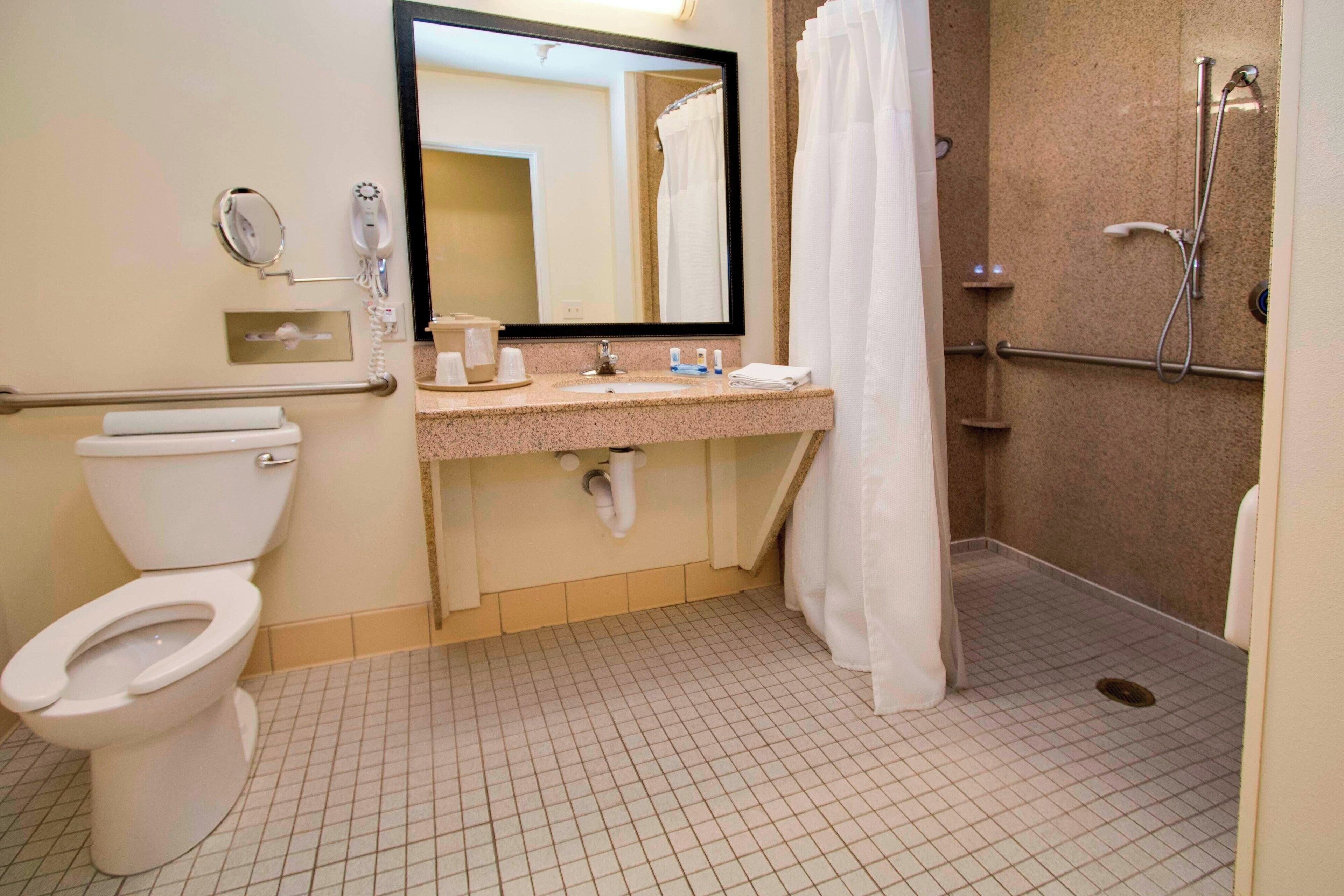 room, 2 queen beds | bathroom | combined shower/bathtub, free toiletries, hair dryer, towels