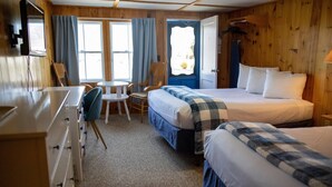 A room with a bed, a desk, a chair, and a window. - Isleview Motel and Cottages (Trenton)