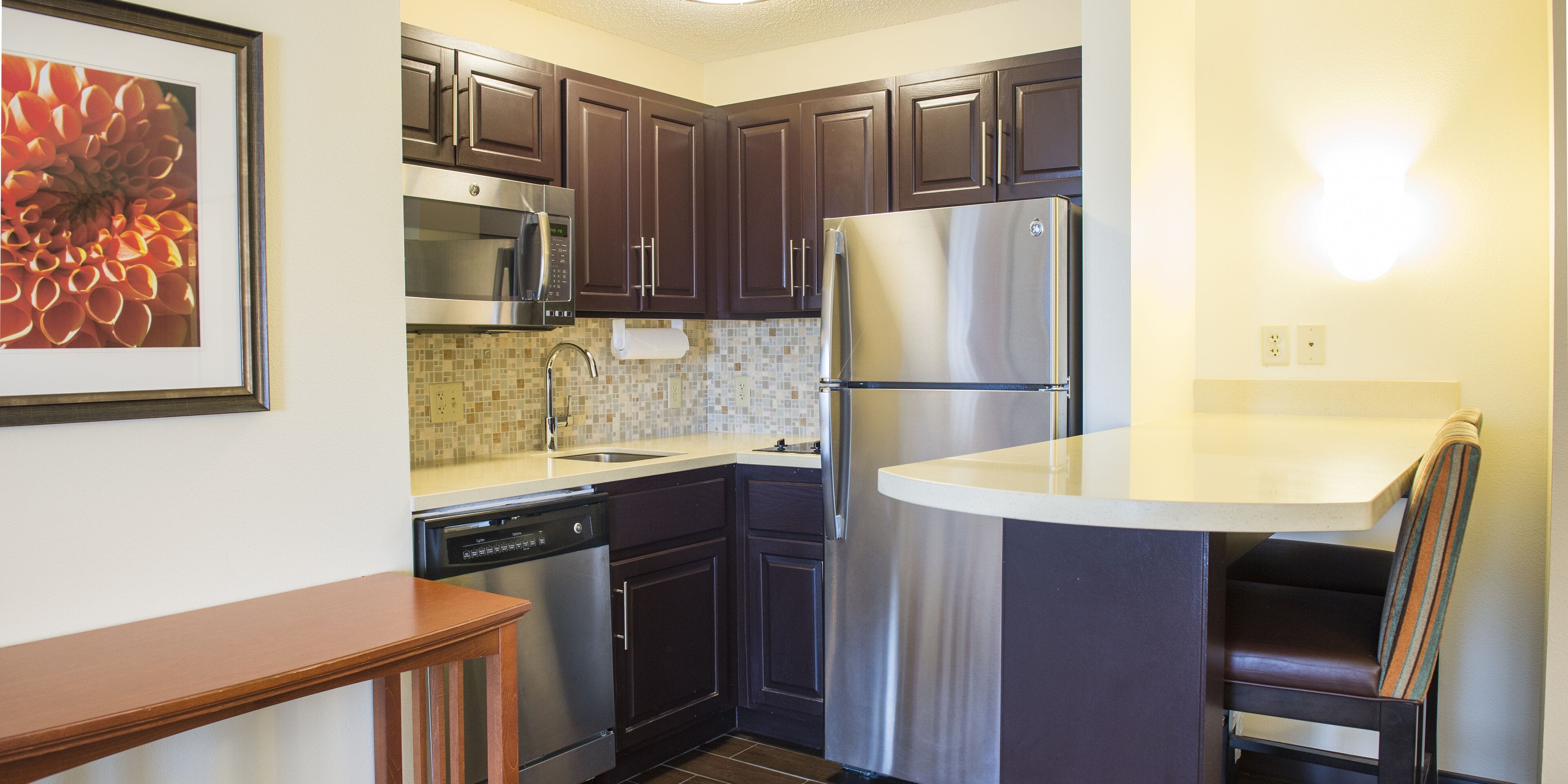 full-sized fridge, microwave, stovetop, dishwasher