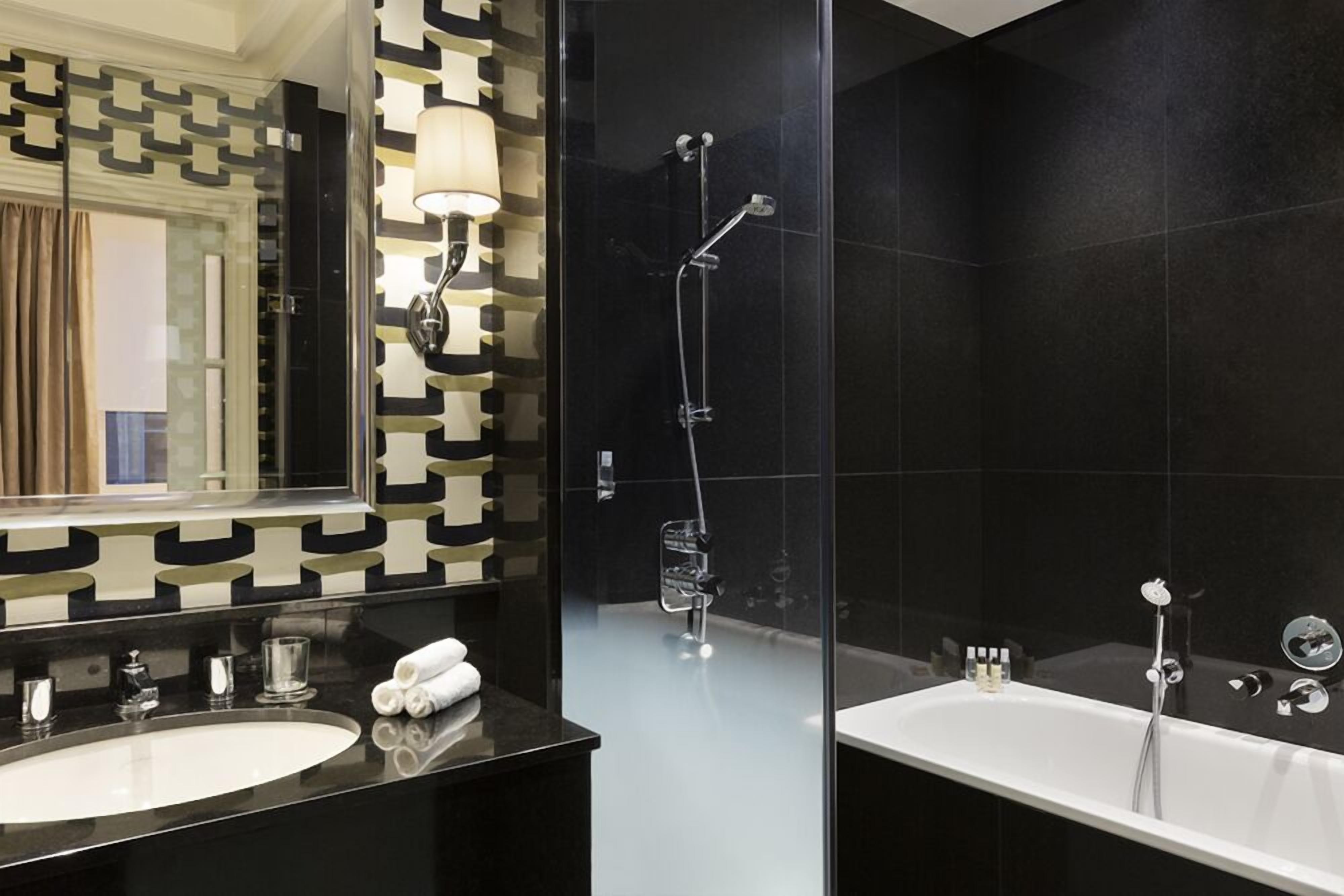 junior suite, 1 king bed with sofa bed | bathroom | separate bathtub and shower, jetted bath, rainfall showerhead