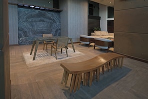 A modern interior with a marble wall, wooden furniture, and a sofa. - Crowne Plaza Villahermosa by IHG (Villahermosa)