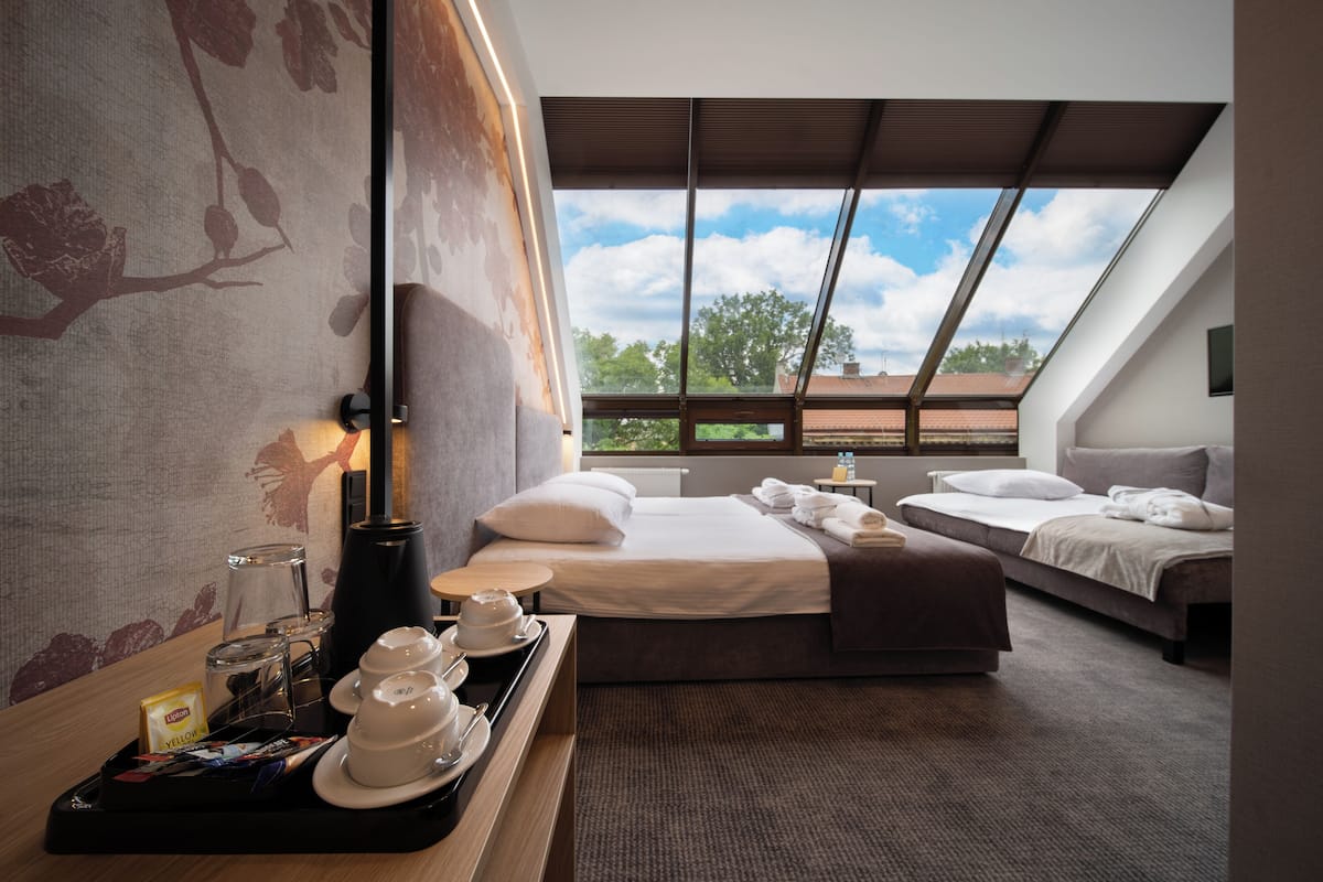 Premium Triple Room | 1 bedroom, desk, laptop workspace, blackout curtains