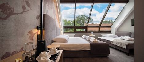 Premium Triple Room | Desk, laptop workspace, blackout drapes, iron/ironing board