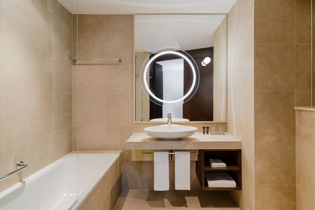 designer toiletries, hair dryer, bathrobes, slippers