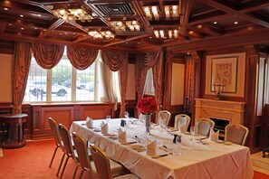 A dining room with a large table set for a meal, elegant chandeliers, and a fireplace. - Fredrick's Hotel Restaurant & Spa (Maidenhead)