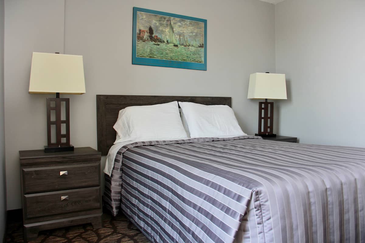 Suite, City View | Blackout drapes, iron/ironing board (on request), WiFi (free)