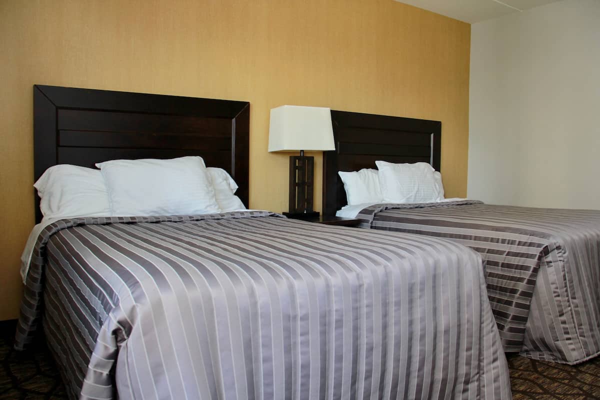 Deluxe Room, 2 Double Beds | Blackout drapes, iron/ironing board (on request), WiFi (free)