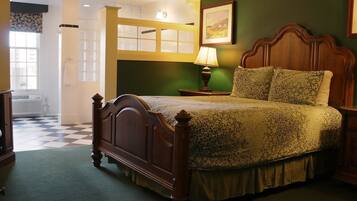 A bedroom with a wooden bed, a nightstand with a lamp, a framed picture on the wall, and a checkered floor.