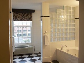 Separate tub and shower, jetted tub, rainfall showerhead, towels