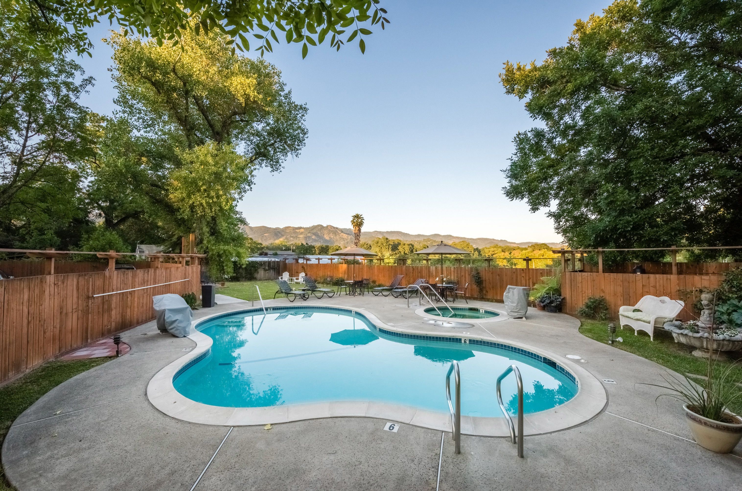 outdoor pool, open 8 am to 10 pm, pool umbrellas, pool loungers