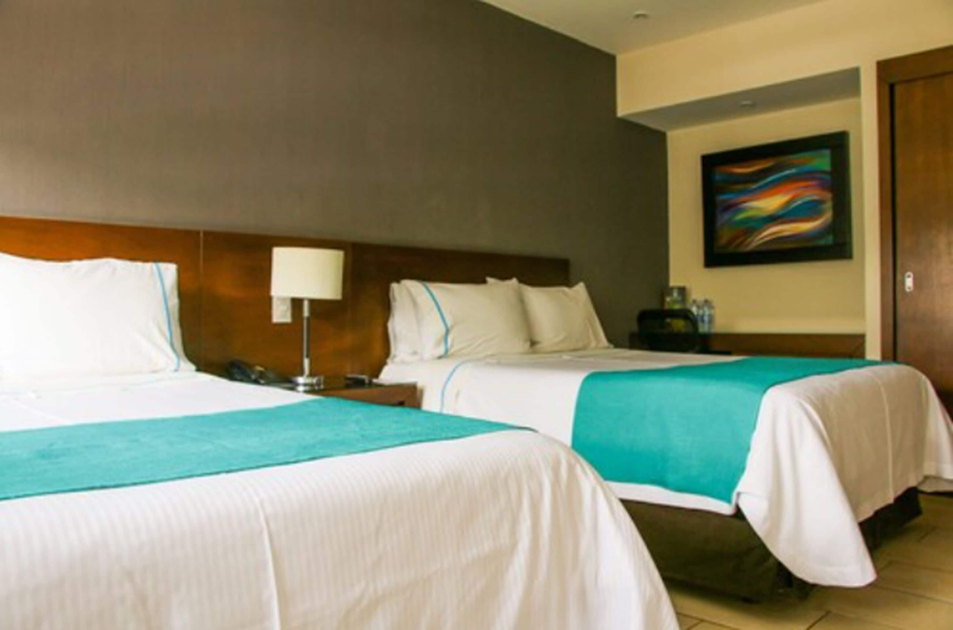 standard room, 2 queen beds | premium bedding, in-room safe, desk, blackout curtains