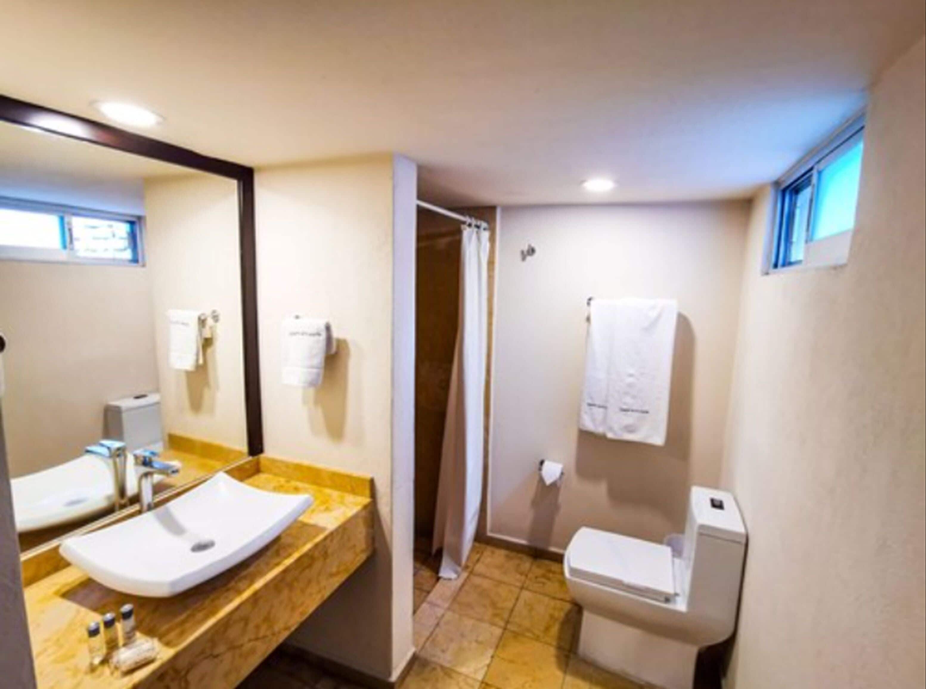 standard room, 2 queen beds | bathroom | free toiletries, hair dryer, towels