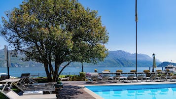 Seasonal outdoor pool, open 8:00 AM to 7 PM, pool umbrellas