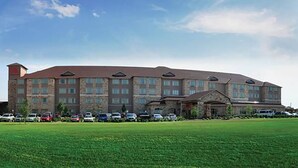 A large hotel with multiple floors and a central entrance. - Hawthorn Extended Stay by Wyndham Killeen (Killeen)