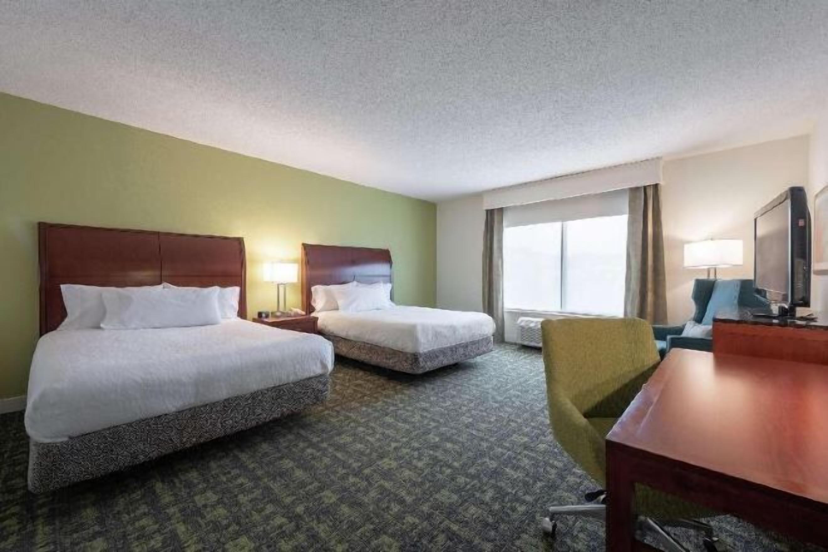 Desk, blackout drapes, iron/ironing board, free cribs/infant beds