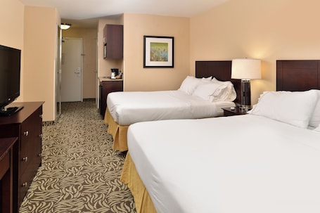 Ropa de cama de alta calidad y caja de seguridad en la habitación