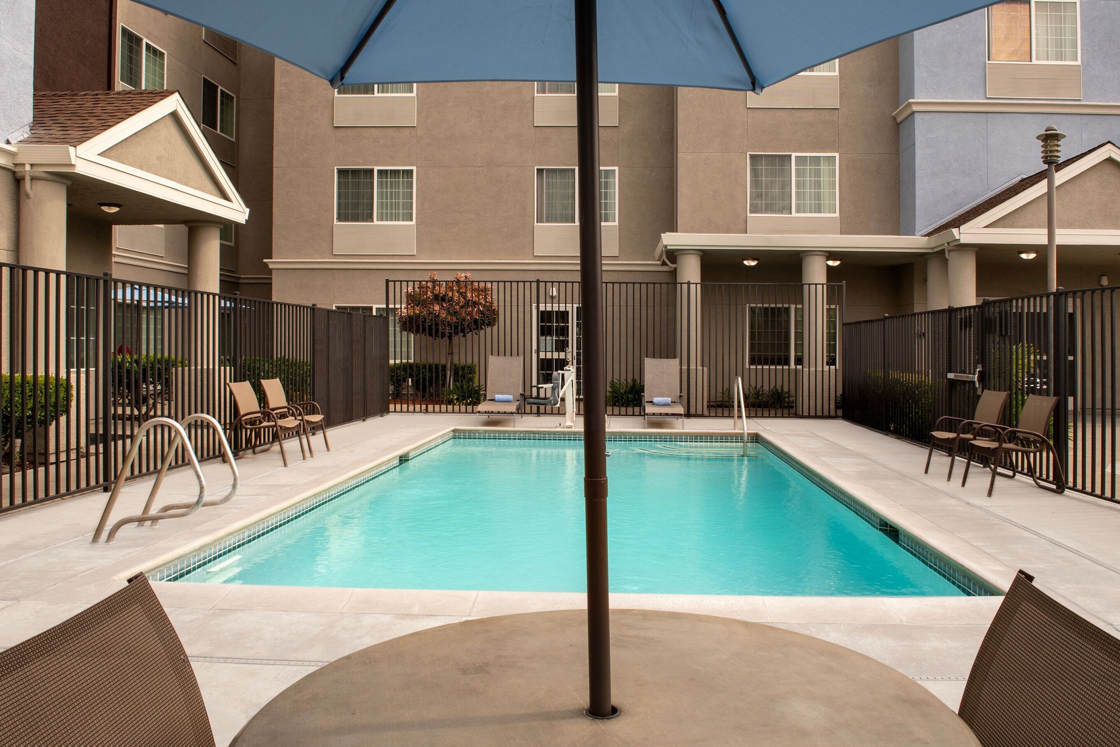 Outdoor pool, open 10:00 AM to 9:00 PM, pool loungers
