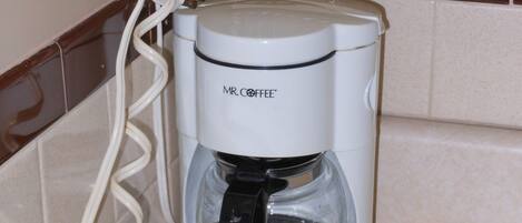 A Mr. Coffee coffee maker on a kitchen counter.