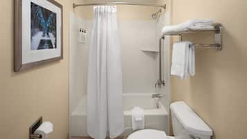 A bathroom with a shower, toilet, and towel rack.
