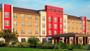 A multi-story hotel with a red and beige facade, named 'Four Points by Sheraton'. - Four Points by Sheraton Moncton (Moncton)