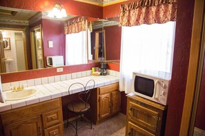 Standard Room, 1 King Bed, Jetted Tub | Living area | 30-inch LCD TV with cable channels, TV, fireplace