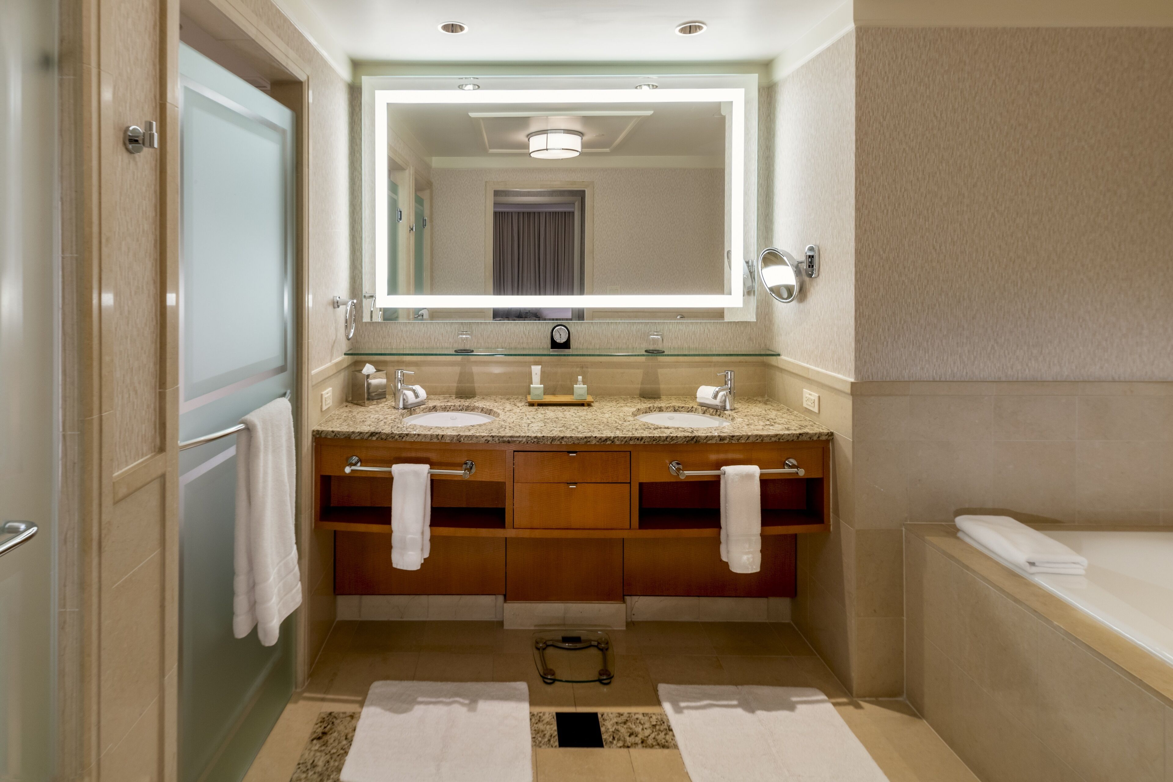 separate bathtub and shower, deep-soaking bathtub, designer toiletries