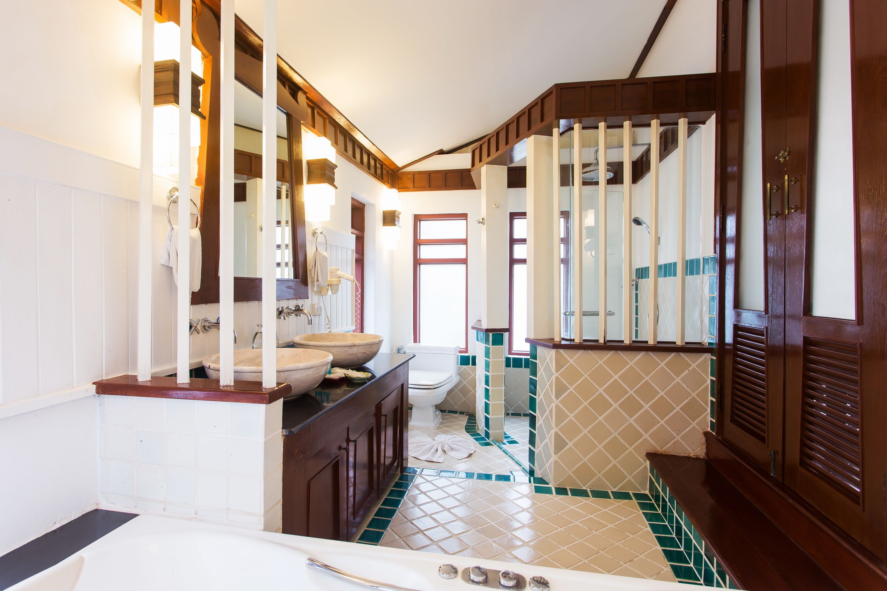 A bathroom with a bathtub, a sink, and a toilet.