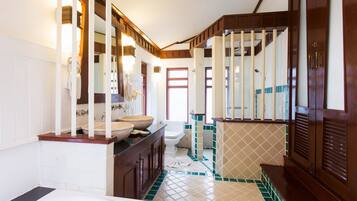 A bathroom with a bathtub, a sink, and a toilet.