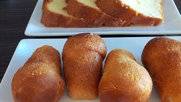 A table with two square plates, each containing several round pastries.