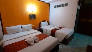 A hotel room with two beds, a nightstand, a wall-mounted light, and a door. - Thepparat Lodge Krabi (Krabi)