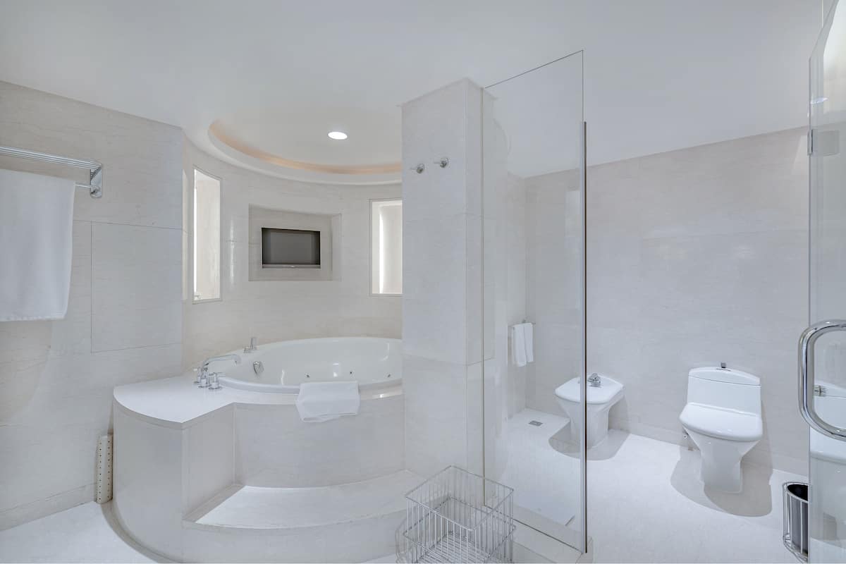 presidential suite, 2 bedrooms | bathroom | separate bathtub and shower, deep-soaking bathtub, rainfall showerhead